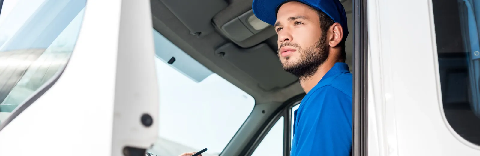 worker in truck wearing hat