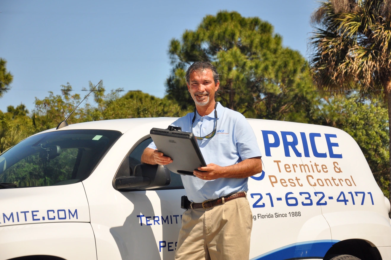 Price exterminator in front of a truck