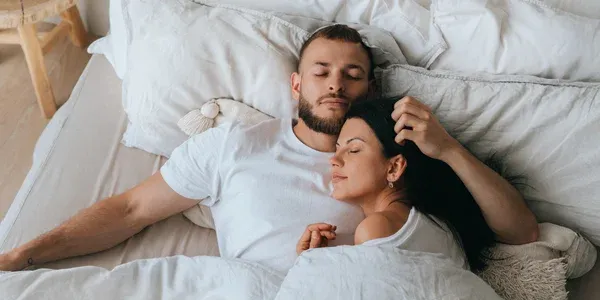 couple sleeping peacefully in bed bug free room